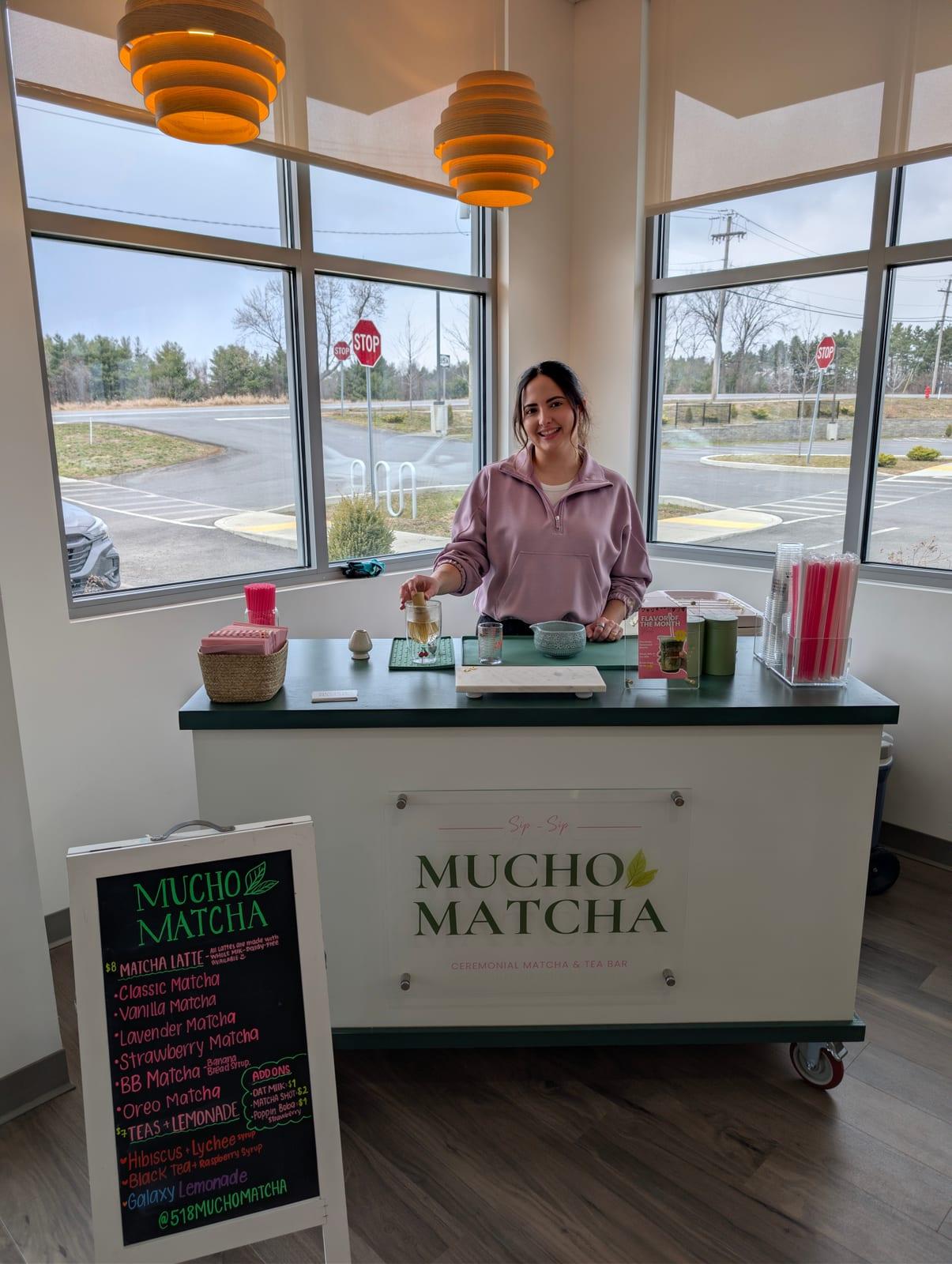 The Mucho Matcha mobile matcha cart set up and serving drinks at an event